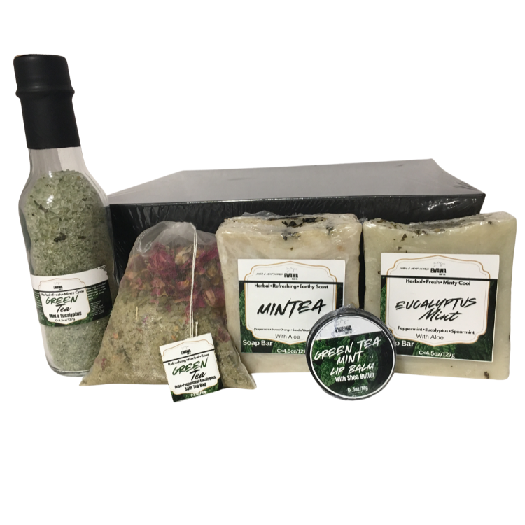 Collection of Aloe green tea and mint-themed hand made products including a bottle, soap bars, Bath Tea bag and lip balm on a white background.